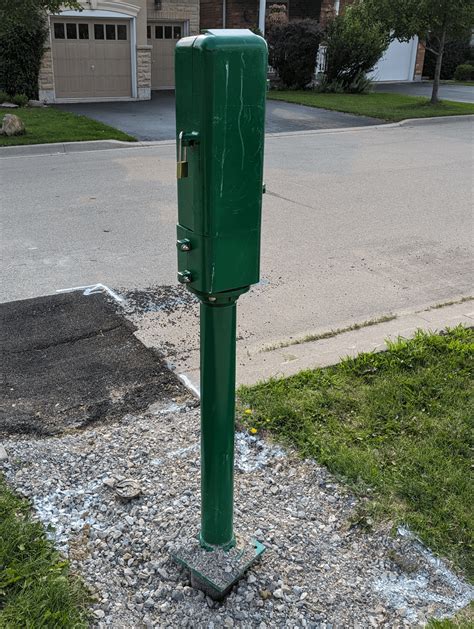 What is this green box on a pole locked with a padlock 